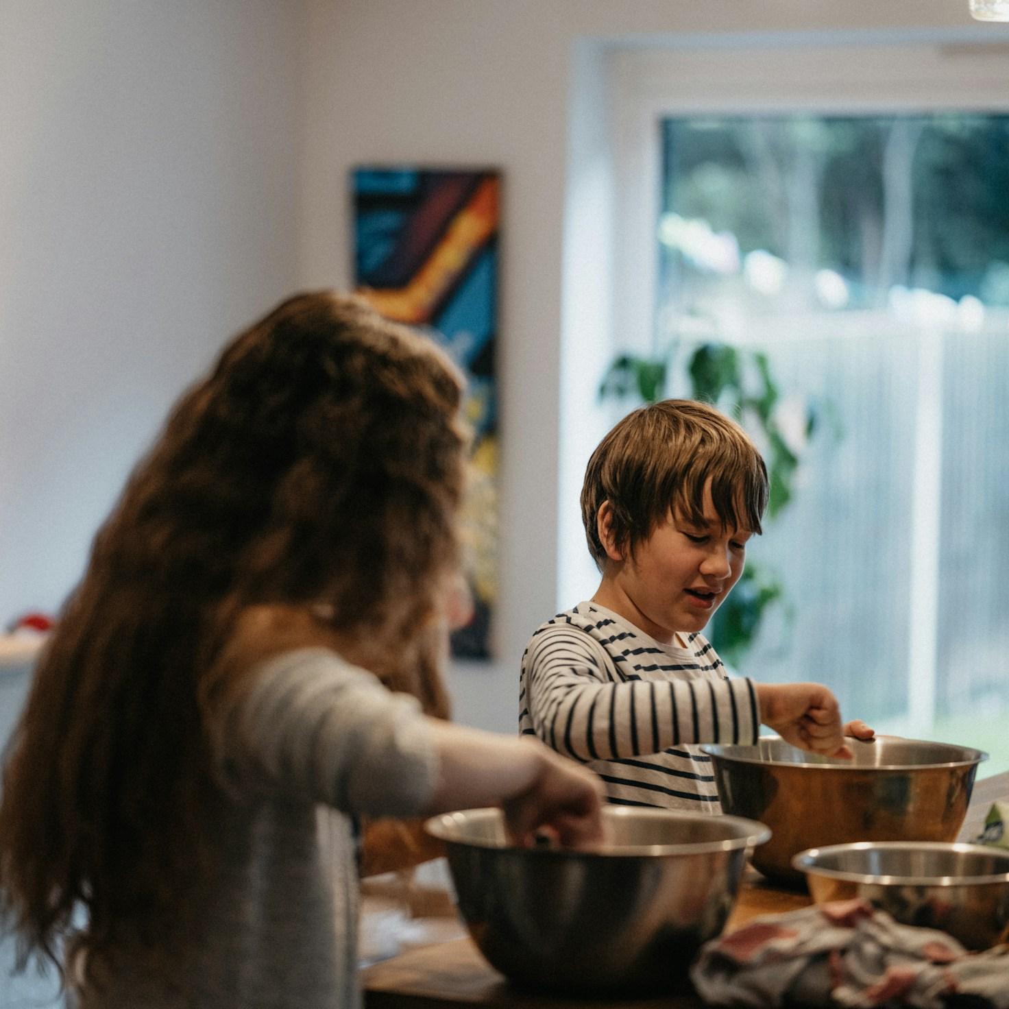 Community members collaborating in a modern kitchen space, exchanging recipes and techniques
